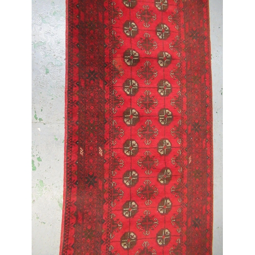 26 - Antique Kurdish rug, having all over stylised floral design, midnight ground with multiple borders, ... 