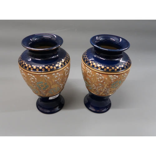 556 - Royal Doulton stoneware tall waisted vase, 13ins together with a similar smaller vase, similar jar a... 