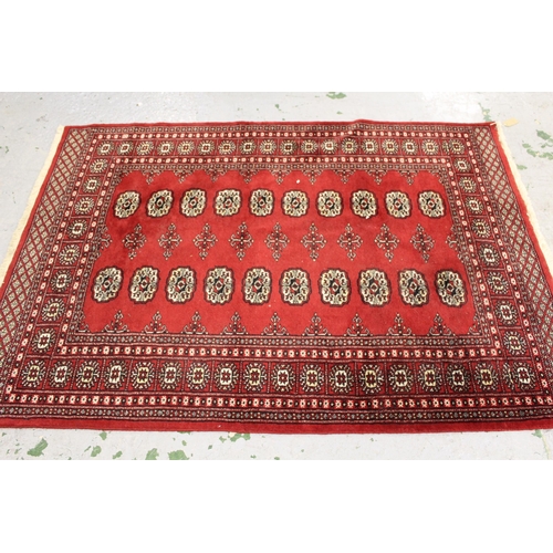 7 - Zanjan rug with a medallion and all-over stylised design on a dark ground with borders, 2.06m x 1.4m