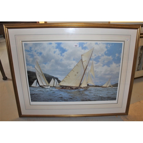 1055 - J. Stephen Dews, signed coloured print, J-Class yachts racing off a coastline, 19.75ins x 30ins appr... 