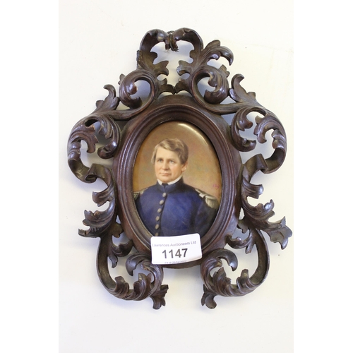 1147 - Oval miniature painting on porcelain, portrait of a military gentleman, period carved wood frame, in... 