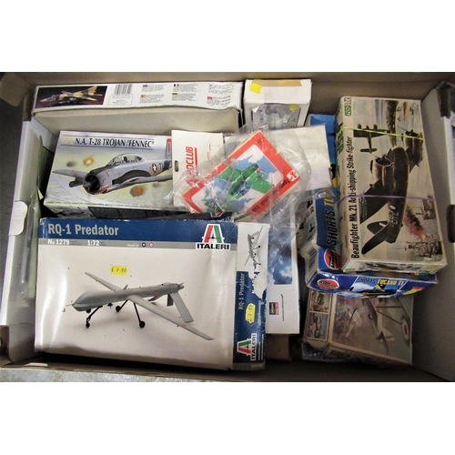 126 - Two boxes of unbuilt scale models of aircraft and helicopters by Revell, Academy and others