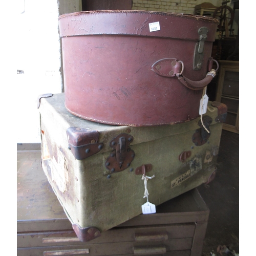 142 - Late 19th / early 20th Century circular leather hat box with brass lock, and another green canvas sm... 