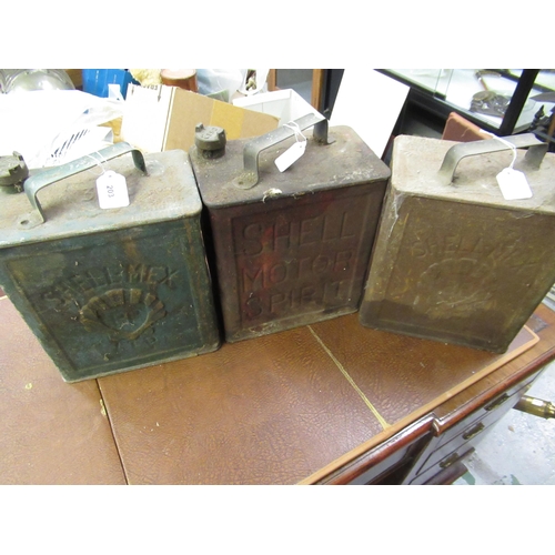 203 - Three vintage petrol cans and various brass caps