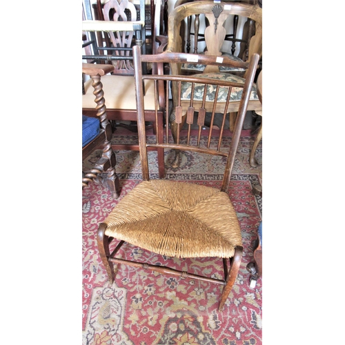 2034 - Early 20th Century beechwood nursing chair with a spindle back and newly rushed seat