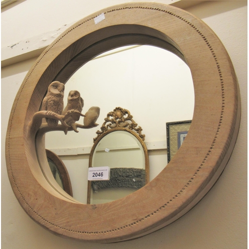 2046 - Unusual 20th Century circular ash wall mirror carved with two owls on a branch, 16.5ins diameter