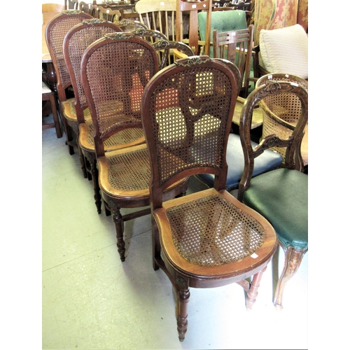 2060 - Set of four late 19th / early 20th Century French walnut salon chairs with caned back and seats, on ... 