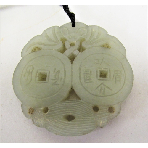 227 - Chinese green stone carved pierced pendant on cord