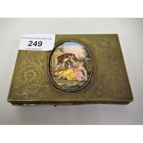 249 - Continental brass rectangular floral engraved and enamel mounted box, decorated with a gentleman and... 