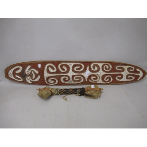 305A - Oval native carved and painted shield, 38ins x 6.5ins together with a native tribal war club