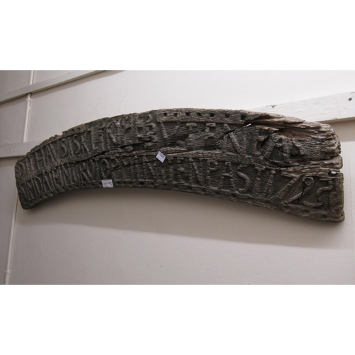 305D - Antique driftwood arched panel carved with various lettering and possibly dated 1795, 38ins wide