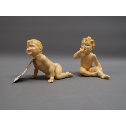 495 - Pair of porcelain figures of children, 4.5ins high