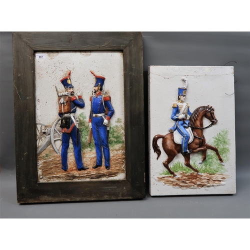 557 - Pair of Continental glazed pottery polychrome relief plaques depicting Napoleonic soldiers, 21.25ins... 