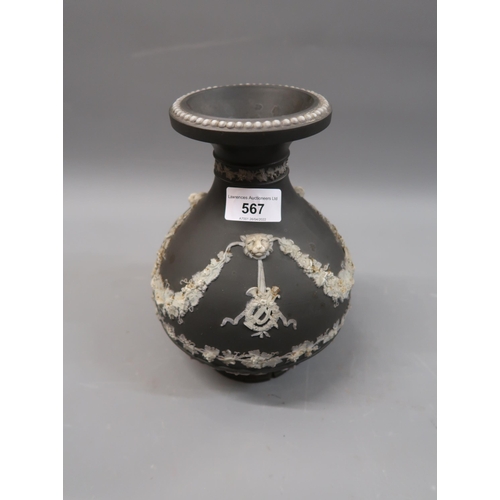 567 - Wedgwood Etruria jasperware black and white baluster form vase with floral swag decoration (foot at ... 