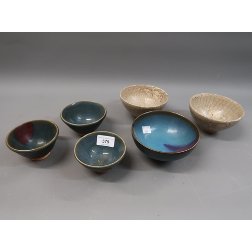 579 - Chinese blue glazed pottery bowl, 5.25ins diameter, three similar smaller bowls and a pair of slip g... 