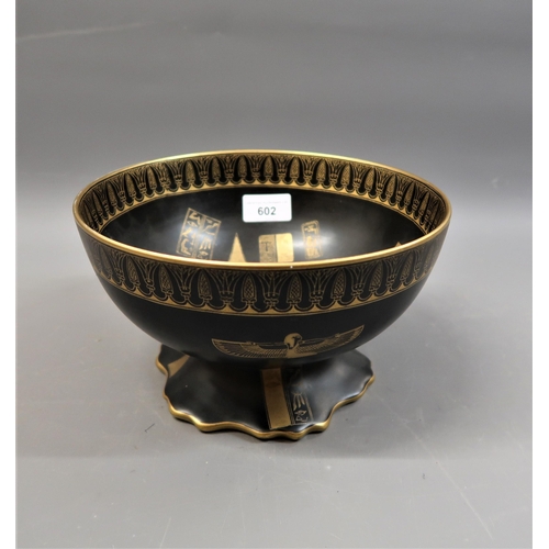 602 - W & R Carlton Ware pedestal bowl decorated with Egyptian figures and emblems in gilt on a black grou... 