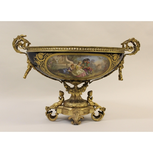 614 - Large late 19th Century Sevres porcelain and ormolu mounted comport, the oval bowl painted with a pa... 