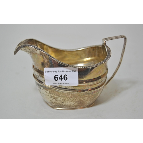 646 - George III silver cream jug with a gadroon rim, London 1812, makers mark rubbed, 3.5oz