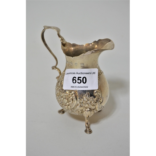 650 - Small Birmingham silver cream jug of embossed baluster form with scroll handle in Georgian style, 18... 