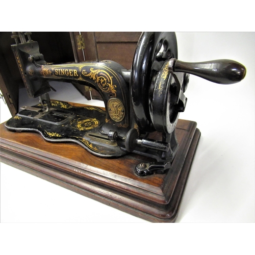 71 - Early Singer model 12K sewing machine in a mahogany case