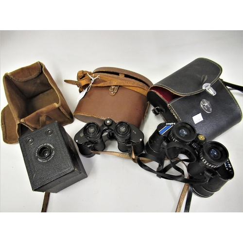 86 - Two cased pairs of binoculars and a box camera