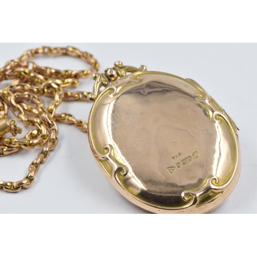 976 - Oval 9ct gold pendant locket in Art Nouveau style, suspended from a 9ct gold chain, gross weight 10.... 