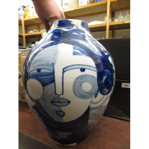 456 - Large modern porcelain baluster form vase decorated with stylised female portraits, 15.5ins high