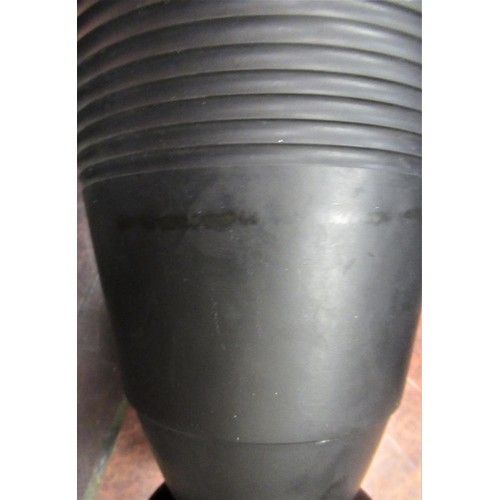 596 - Wedgwood Keith Murray black basalt vase of ribbed tapering form, 8ins high