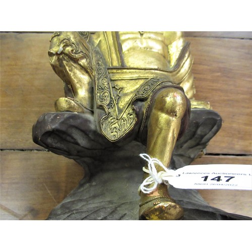 147 - Asian carved wooden and gilded figure of a seated sage (at fault), 10.5ins high and a carved wooden ... 