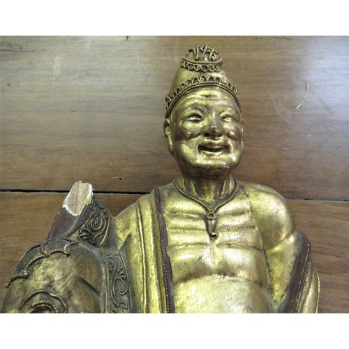 147 - Asian carved wooden and gilded figure of a seated sage (at fault), 10.5ins high and a carved wooden ... 