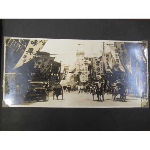 231 - Red photograph album containing a collection of various Chinese photographs and postcards