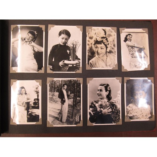 231 - Red photograph album containing a collection of various Chinese photographs and postcards