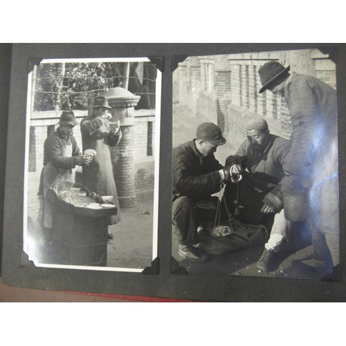 231 - Red photograph album containing a collection of various Chinese photographs and postcards