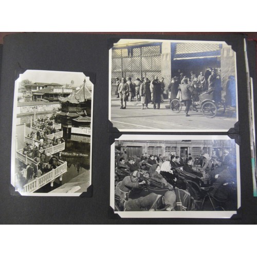 231 - Red photograph album containing a collection of various Chinese photographs and postcards