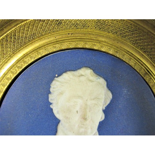 548 - Wedgwood blue and white jasperware plaque, mounted in a gilt and ebonised frame possibly of Wellingt... 