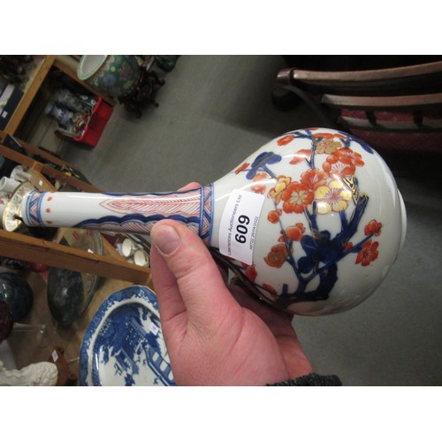 609 - Chinese porcelain bottle vase painted in red, blue and gilt with flowers, 8ins high