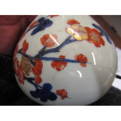 609 - Chinese porcelain bottle vase painted in red, blue and gilt with flowers, 8ins high