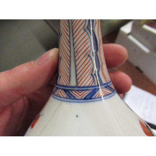 609 - Chinese porcelain bottle vase painted in red, blue and gilt with flowers, 8ins high