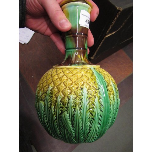 494 - Continental Majolica pineapple form carafe with cover, a pottery dish, the cover mounted with a bird... 