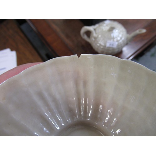 618 - 19th Century Belleek (black mark) part tea service comprising:  a teapot and cover, two cake plates,... 