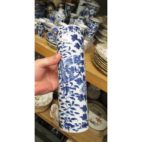 519 - Pair of Chinese blue and white cylindrical vases decorated with dragons and two prunus blossom blue ... 