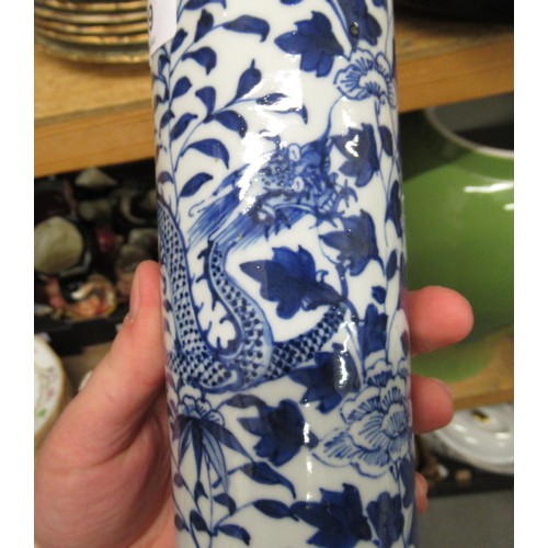 519 - Pair of Chinese blue and white cylindrical vases decorated with dragons and two prunus blossom blue ... 