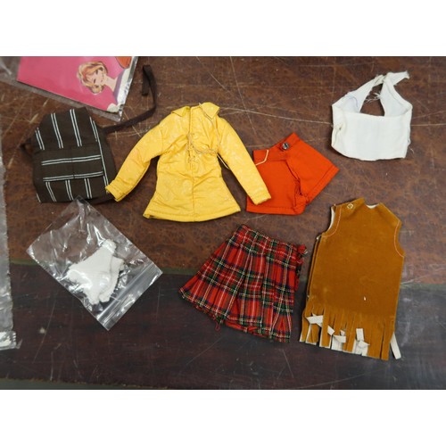 191 - One Sindy doll and one Action Girl together with clothing and accessories