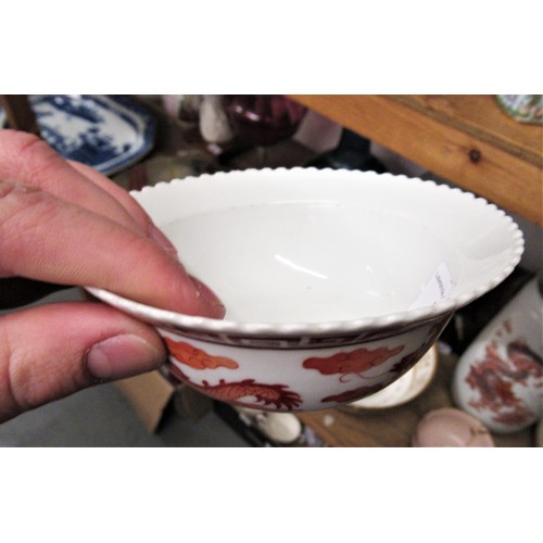 588 - Small Chinese bowl decorated with dragons in iron red, six character mark to base, 4.75ins diameter,... 