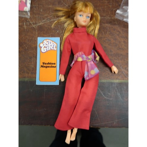 191 - One Sindy doll and one Action Girl together with clothing and accessories