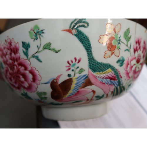 606 - Chinese famille rose circular pedestal bowl painted with exotic birds and flowers (hairline crack), ... 