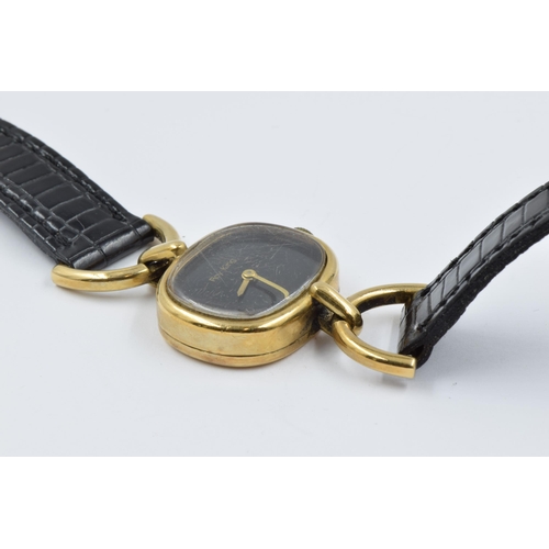 1001 - Roy King ladies 9ct gold cased wristwatch with a black leather strap, gross weight 15.5gms