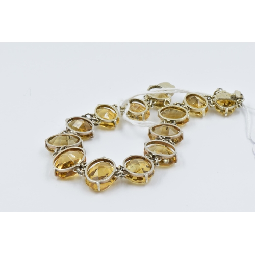 1022 - 19th Century graduated citrine silver mounted bracelet set thirteen citrines, the largest approximat... 