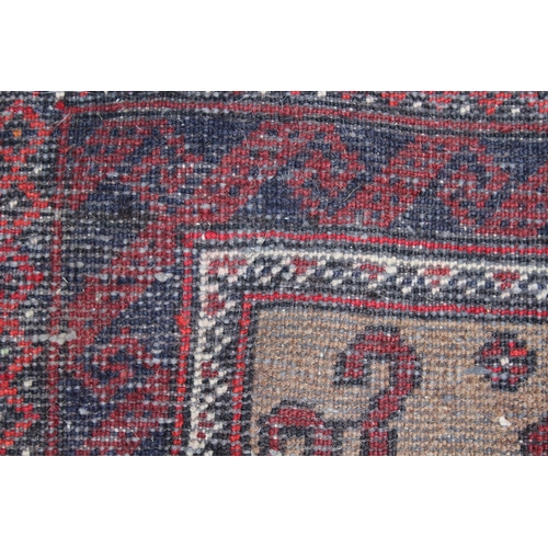 14 - Afghan runner with a multiple hooked medallion design on a beige ground with borders, 11ft 3ins x 3f... 