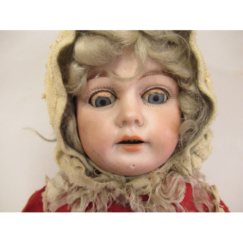 223 - Early 20th Century bisque headed doll with sleeping eyes, open mouth and four teeth on a jointed com... 